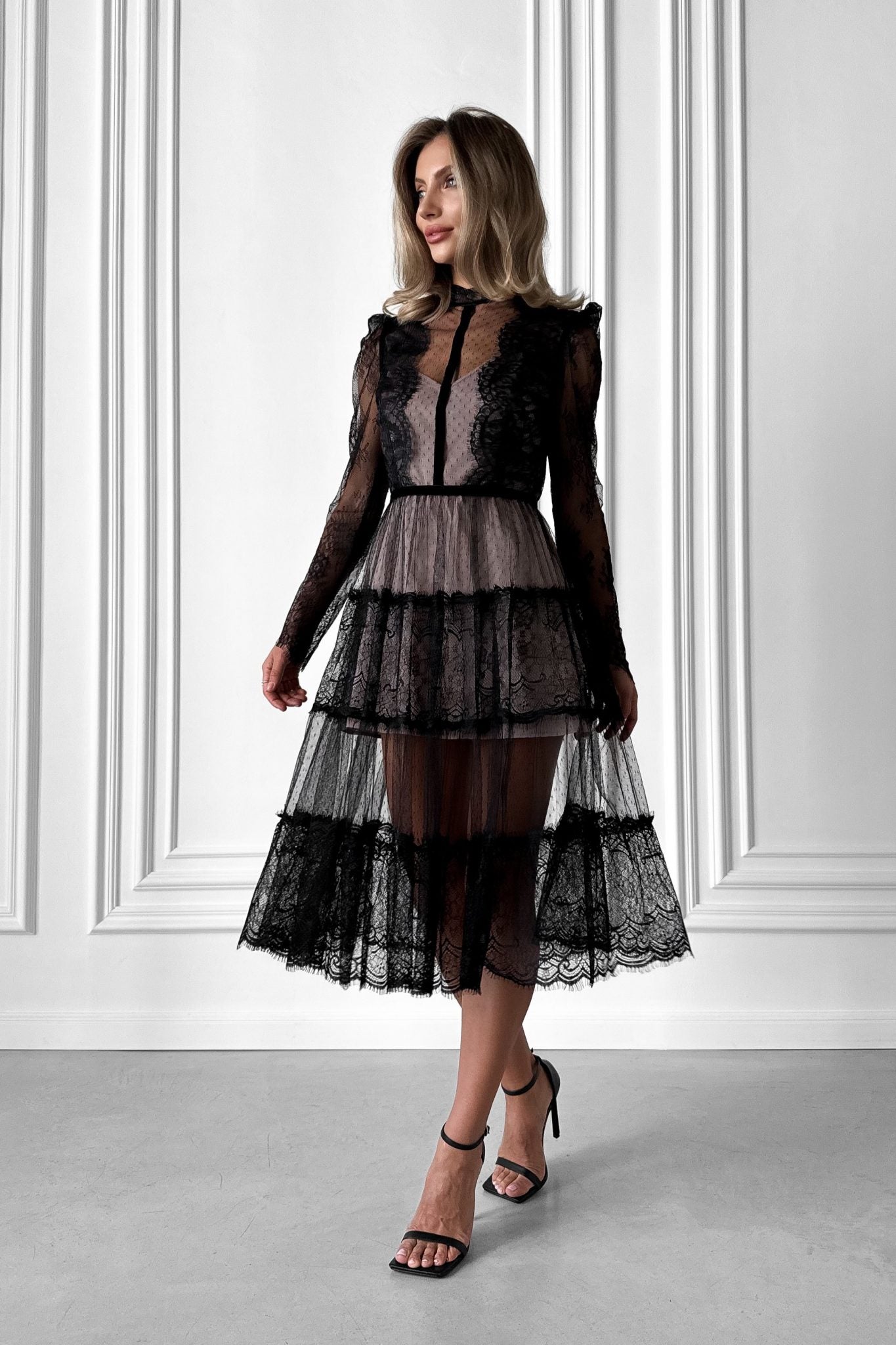 Elegant transparent lace dress with beige lining.