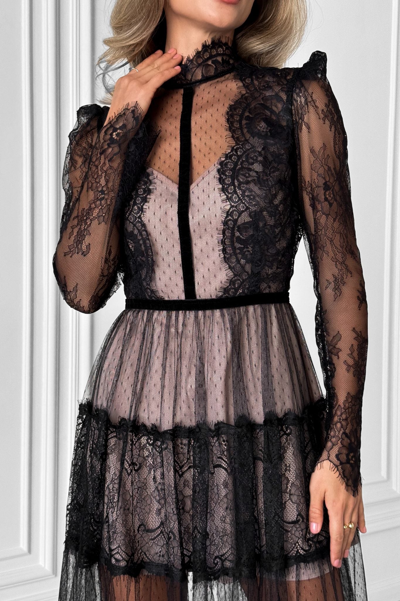 Elegant transparent lace dress with beige lining.