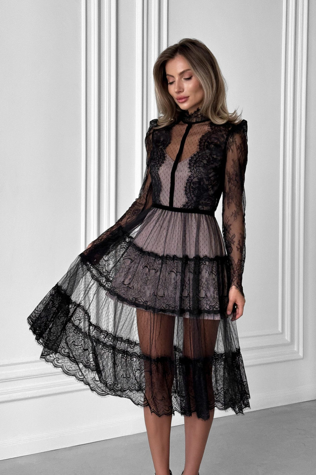 Elegant transparent lace dress with beige lining.