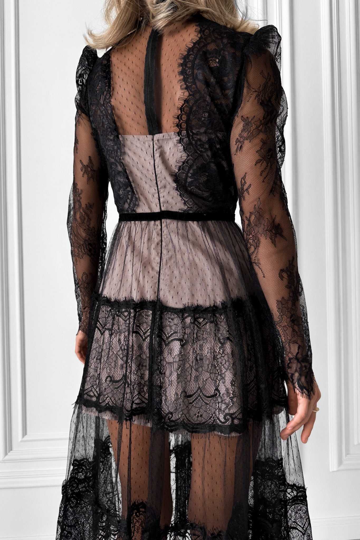 Elegant transparent lace dress with beige lining.